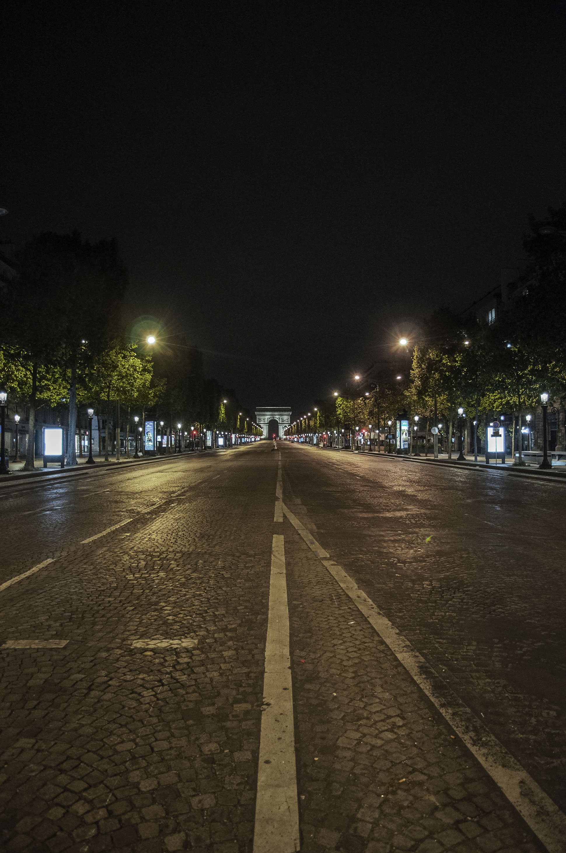 Paris avenue des Champs Elysées empty street at night from Concorde to Charles de Gaulle Etoile, due to the new coronavirus COVID-19 2020, (Nos Dren)