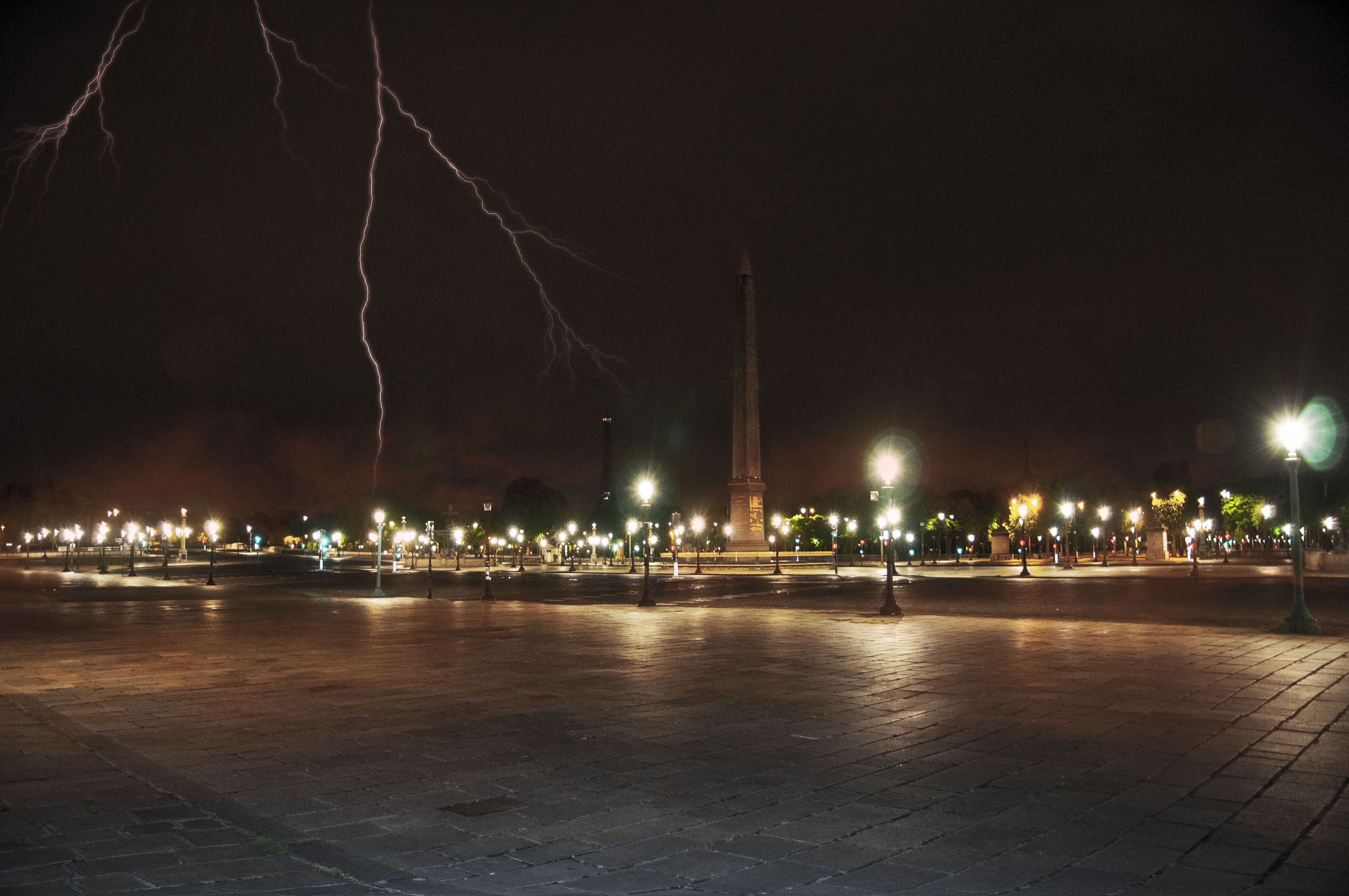 Paris Place de la Concorde under thunder lightnings, empty by night, (Nos Dren).