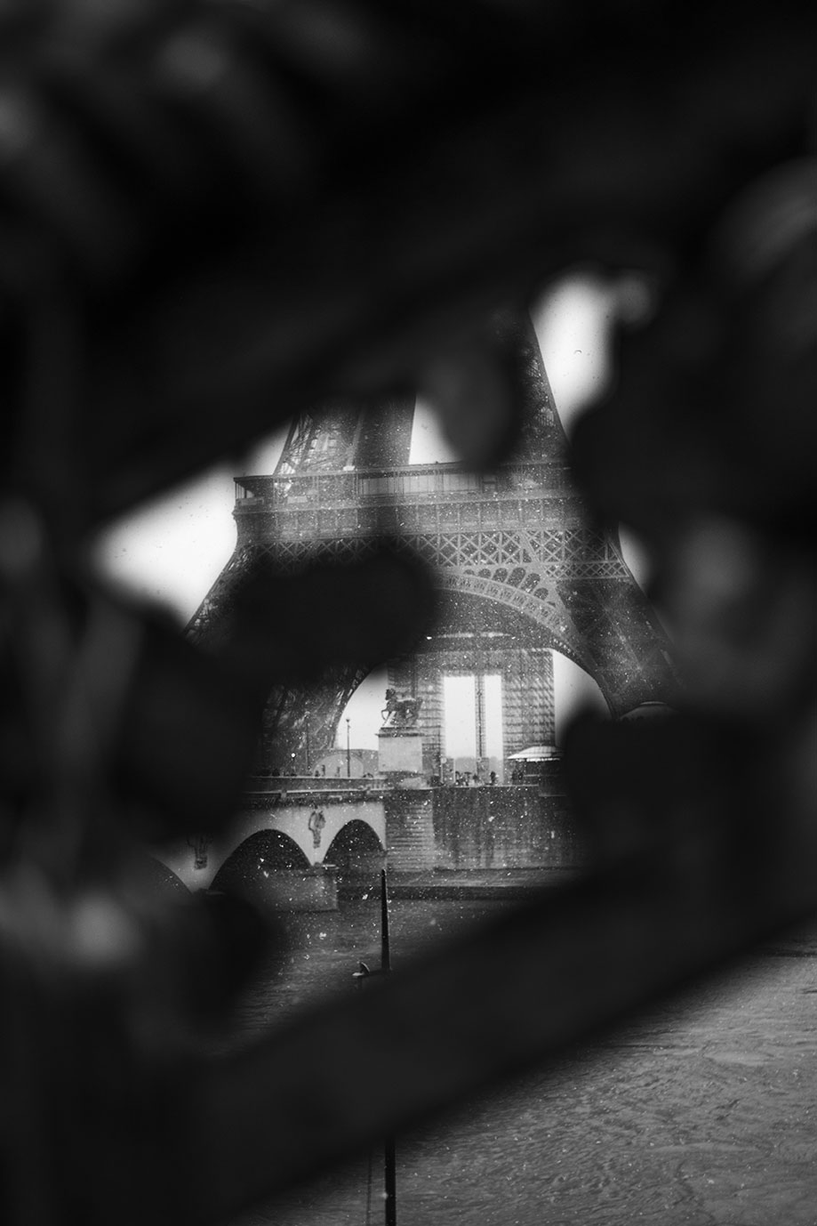 Close-up on lockpads at Pont d'Iéna, under snow, Eiffel Tower, Paris, France 2021 (Nos Dren).