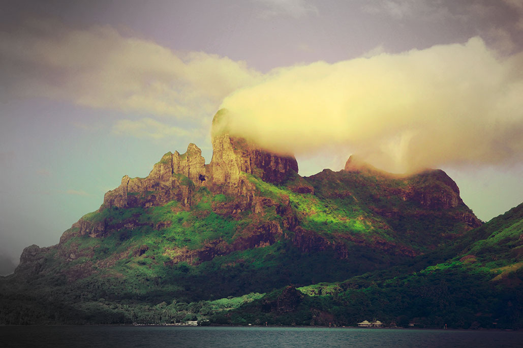 French Polynesia, Bora Bora island, mount Otemanu from aside with clouds, mist and dramatic light. (Nos Dren)