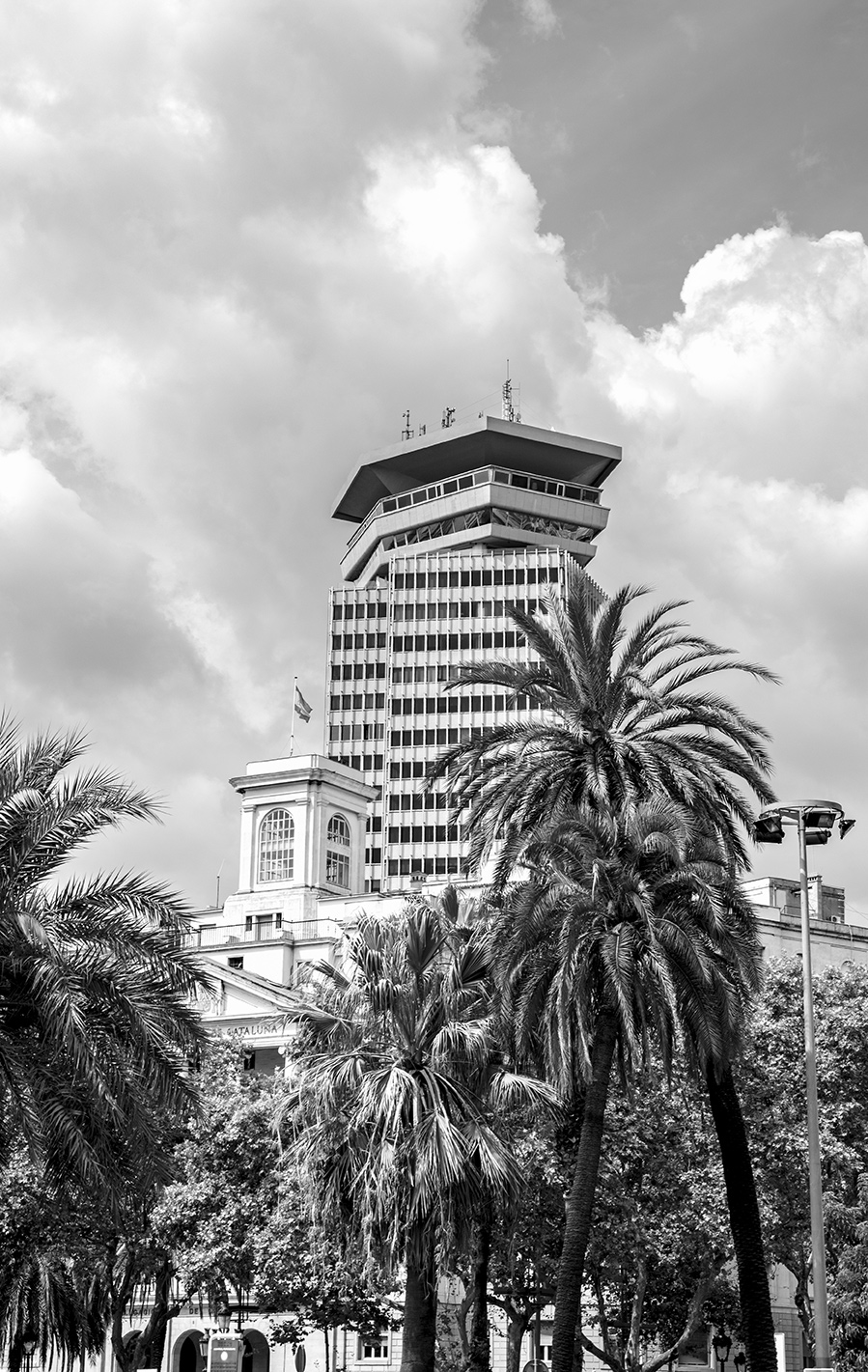Black and white photography of the Edifici Colom skyscrapper building at avenida Drassanes, Barcelona, Catalonia, Spain, (Nos Dren).