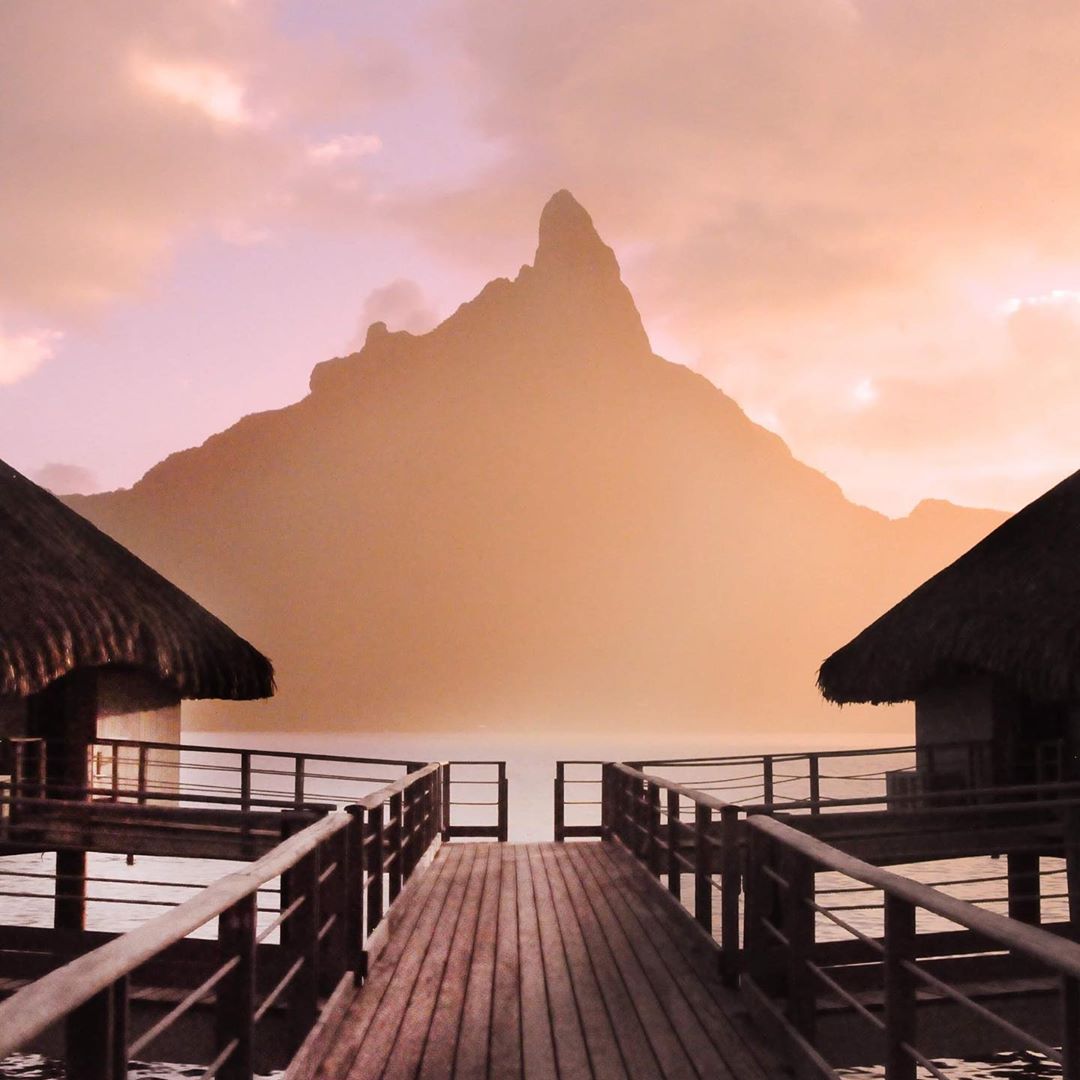 French Polynesia, Bora Bora island, the shadow of the Mount Otemanu in the sunrise fog took from the stilt houses at Le Méridien Bora Hotel. (Nos Dren)